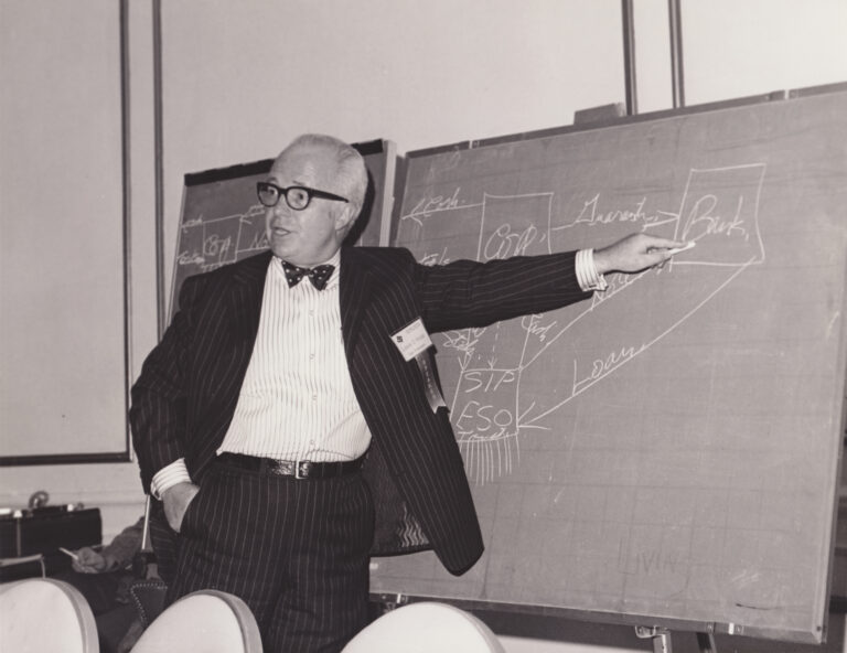 Louis Kelso at a blackboard